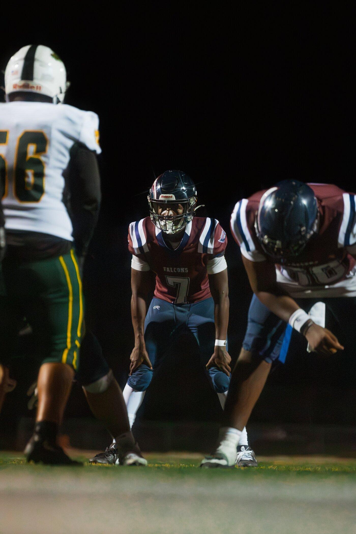 Freedom Falcons quarterback at the line against Fremont