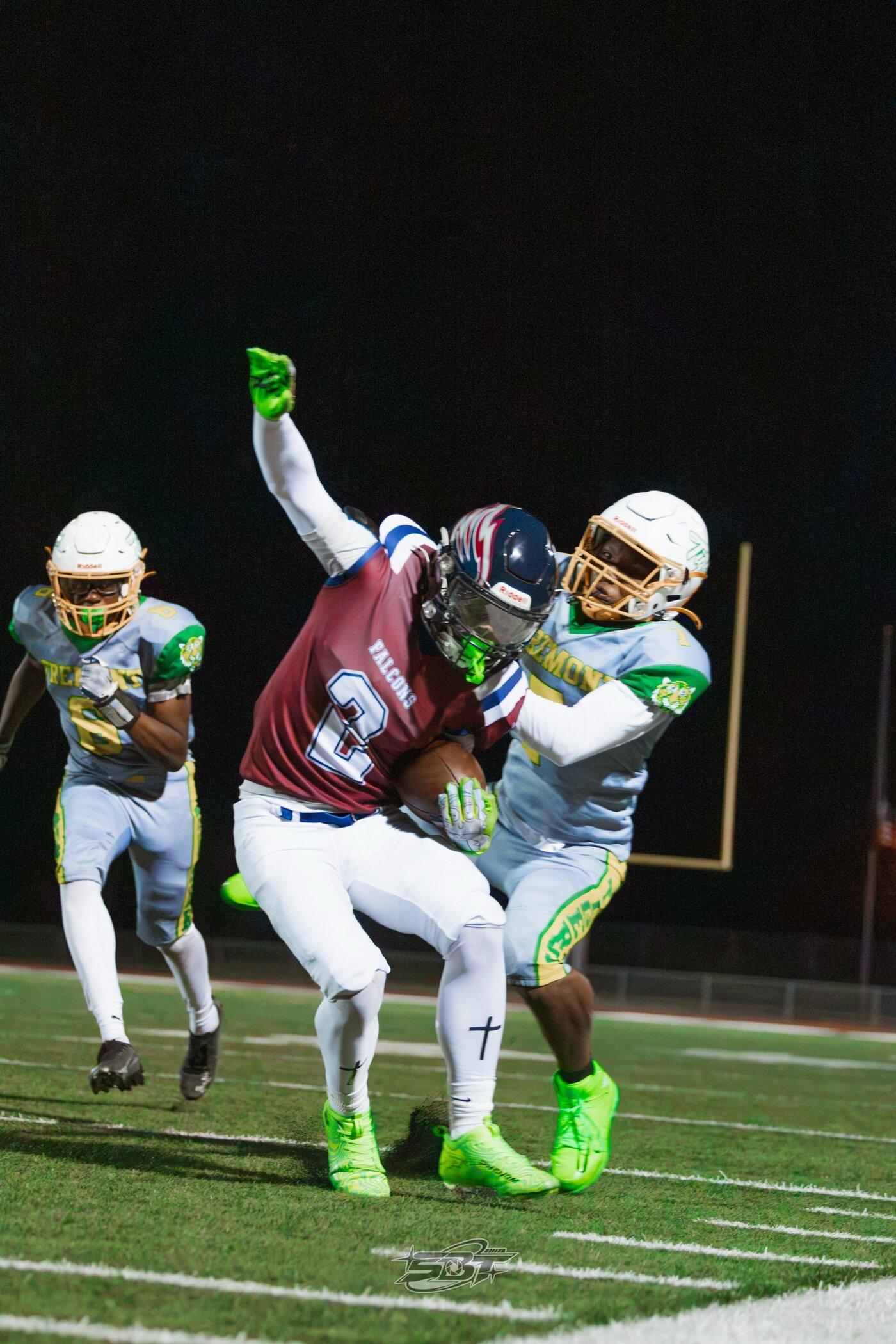 Freedom Falcons defender making a tackle against Fremont