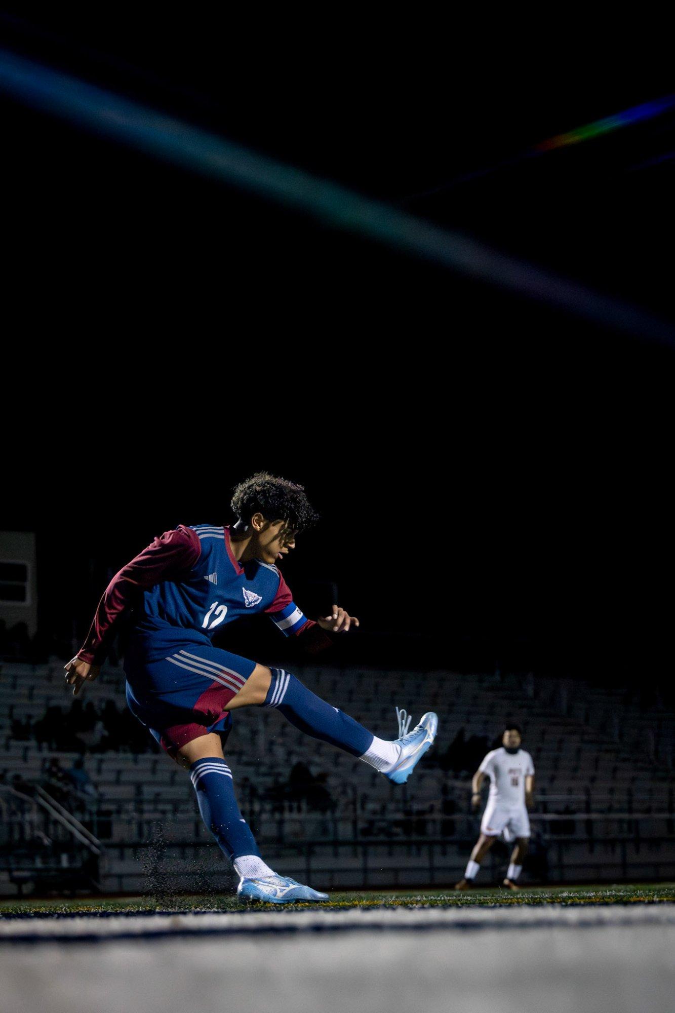 Freedom soccer player striking the ball against Pittsburg